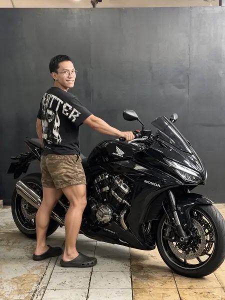 An HB Motors customer with their motorcycle